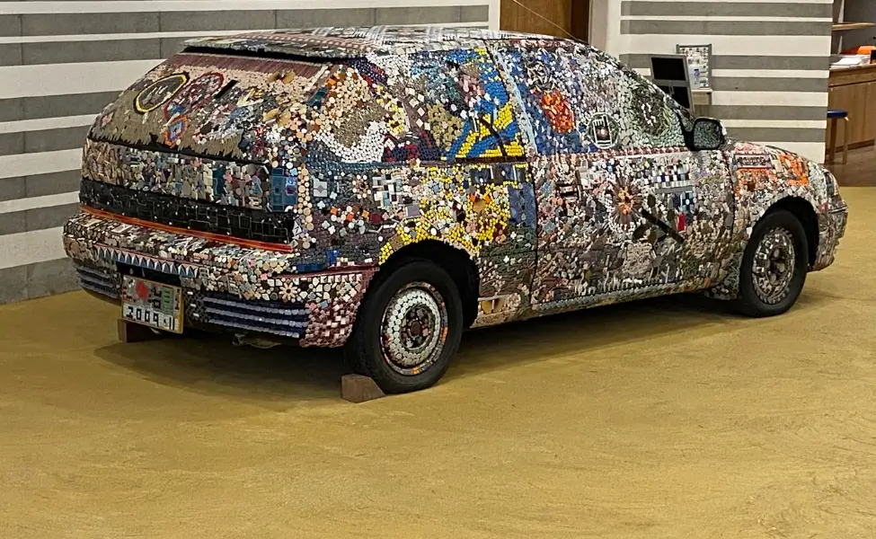 A car covered in tiles A car covered in tiles